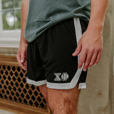 Chi Phi Greek Fraternity Black 7" Mesh Shorts with Greek letters.