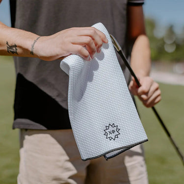 Chi Phi golf towel embroidered with Greek letters.