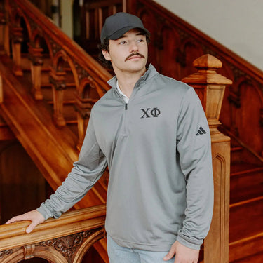 Chi Phi Fraternity Grey Adidas Lightweight Performance 1/4 Zip with Greek letters.